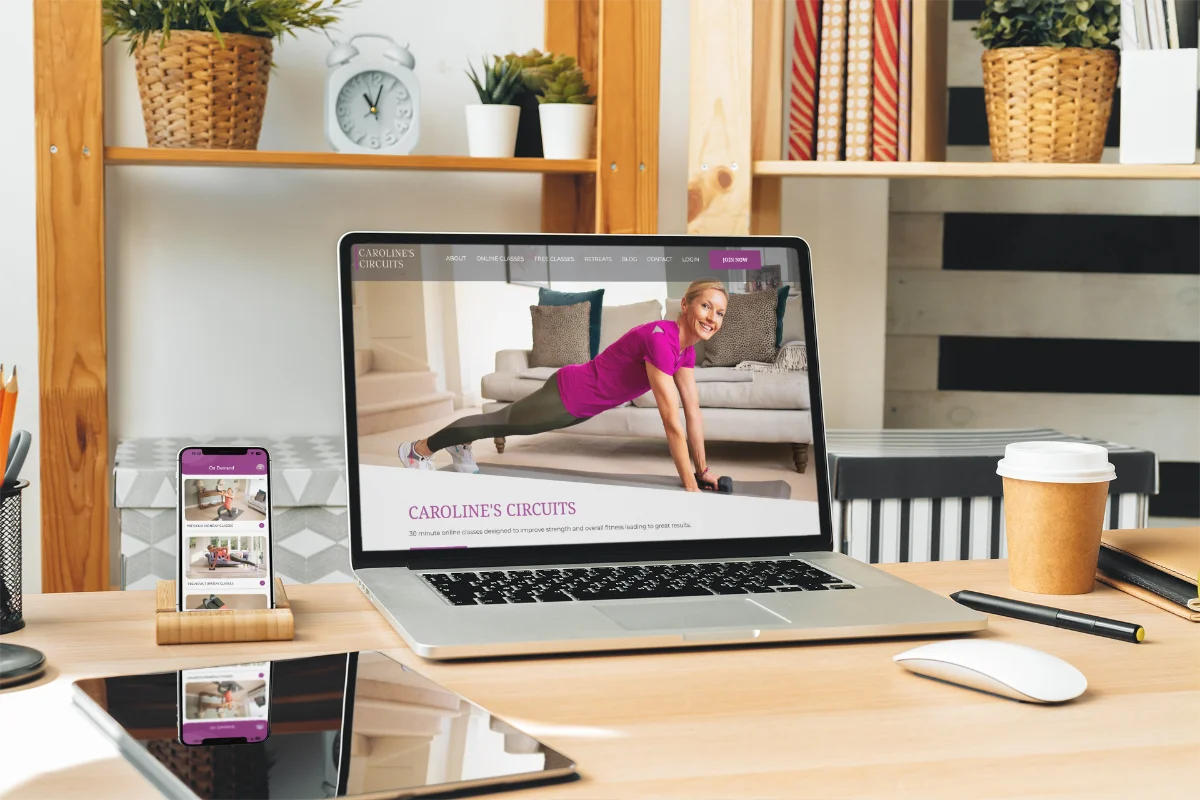 Caroline's Circuits redesigned website on a laptop alongside the new app on a phone